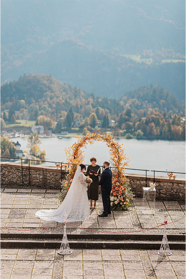 Intimate ceremony moment during a 2025 Lake Bled wedding overlooking Lake Bled and the surrounding mountains