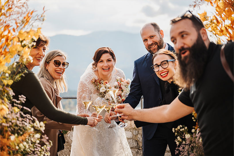 Celebratory moment with the couple and wedding team during a 2025 Lake Bled wedding at Bled Castle