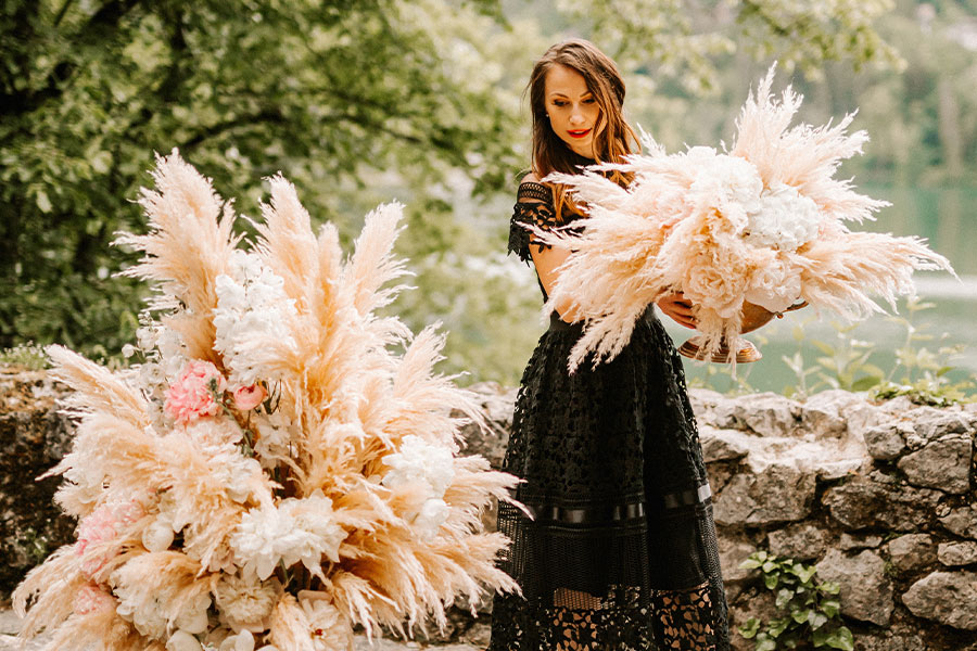 Lake Bled proposal styling with pampas grass and soft florals, elegant setup details