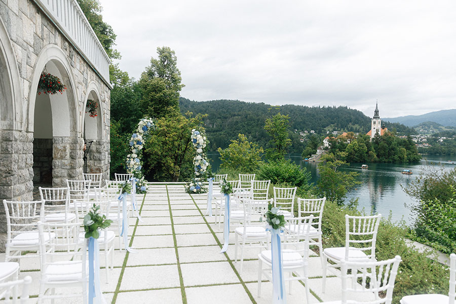 Elegant outdoor ceremony setup overlooking Bled Island, ideal for an intimate Lake Bled wedding 10–15 K€ with minimal florals.