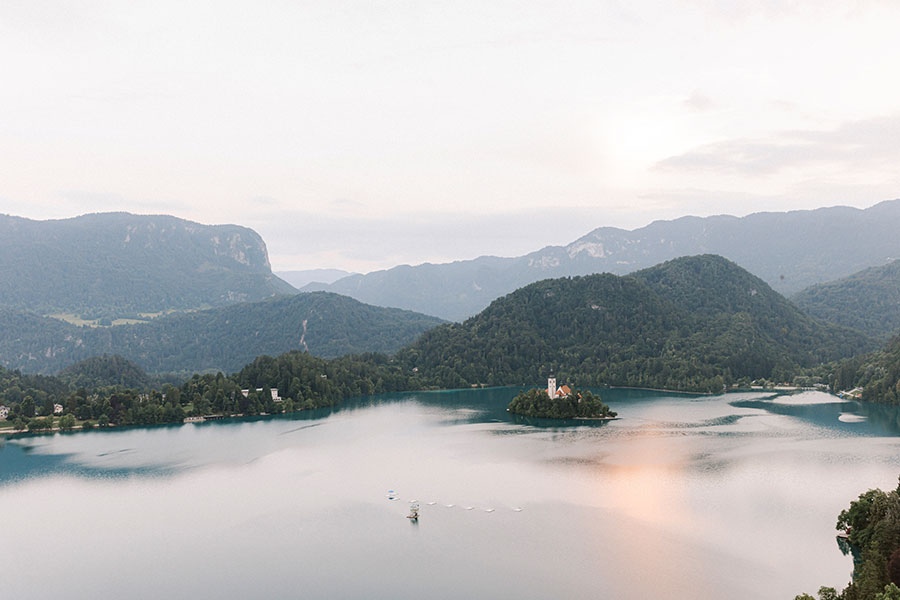 Aerial view of Lake Bled with Bled Island and the surrounding Julian Alps, a signature wedding destination in Slovenia.