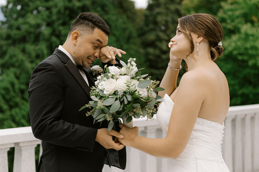 Emotional moment during personal vows at a Lake Bled wedding ceremony.