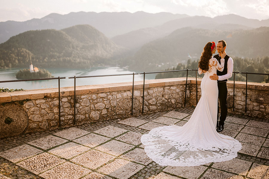 Romantic sunset couple portrait overlooking Lake Bled.