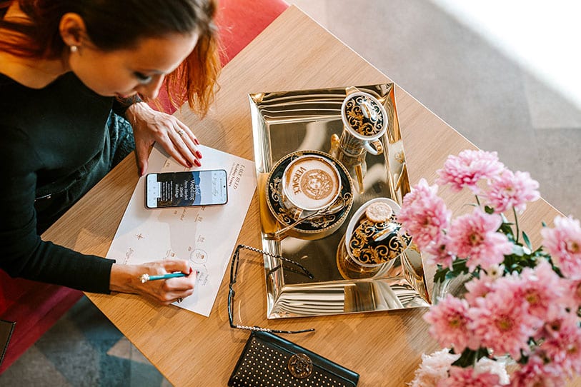 Top Lake Bled Wedding planner is showing a Lake Bled Top Wedding Venues map during drinking coffe with bride and groom